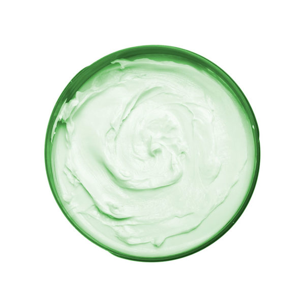 Topdown of open green container of cream.